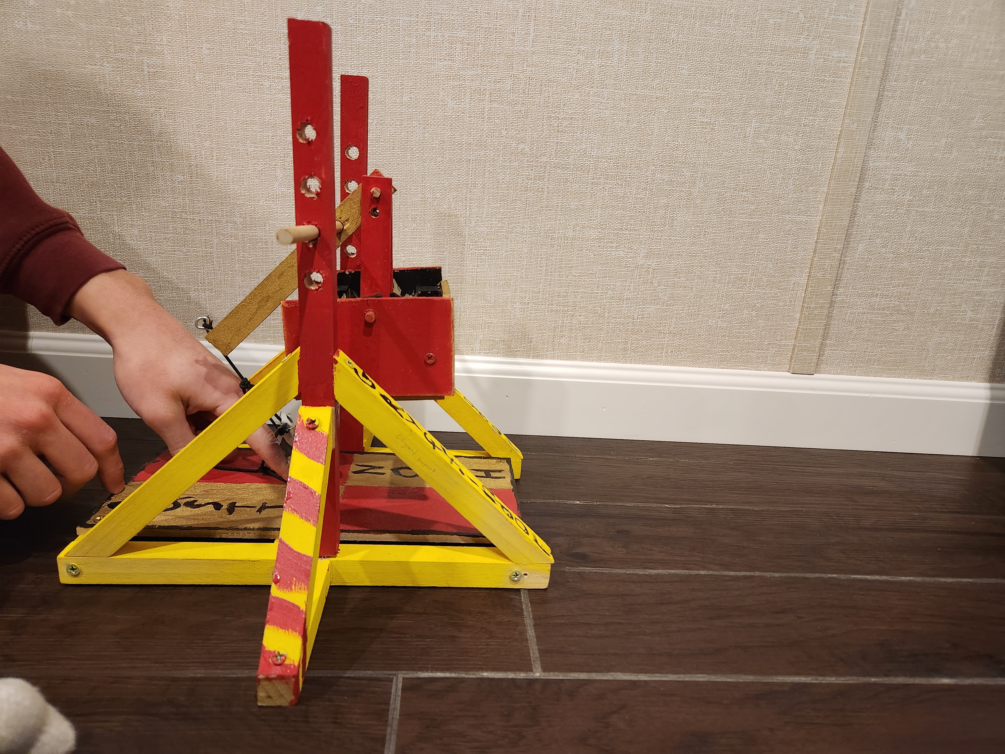 Miniature decorated wooden trebuchet