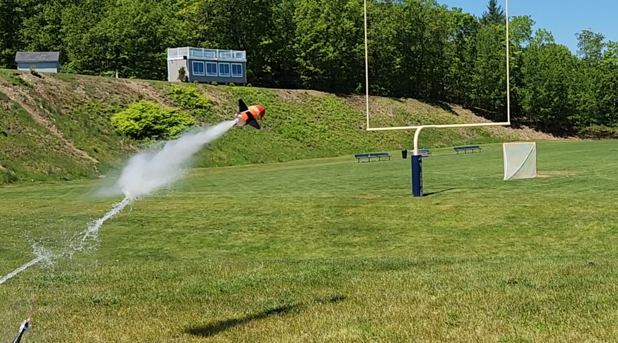 Pressurized air pushes water out of a rocket